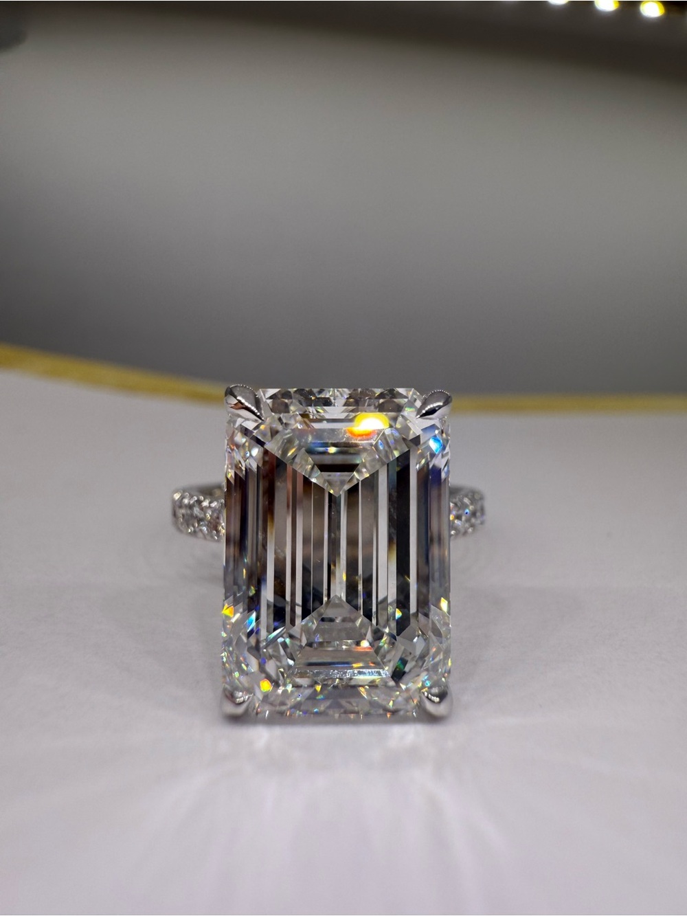 8.21 carat F VVS2 emerald cut lab diamond on a pave band